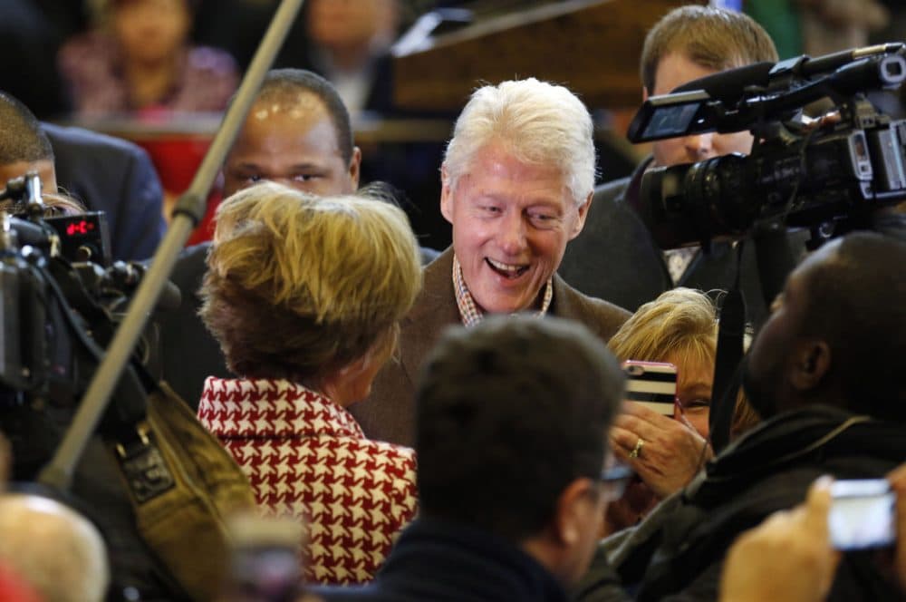 Former President Bill Clinton greets voters during a campaign stop for his wife Monday in New Hampshire. (Jim Cole/AP)
