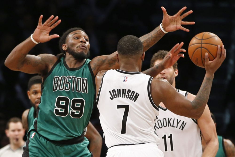 Celtics forward Jae Crowder (99) defends Brooklyn Nets forward Joe Johnson (7) who looks to pass as Brooklyn Nets center Brook Lopez (11) waits on the floor, right, in a game Monday in New York. (Kathy Willens/AP)