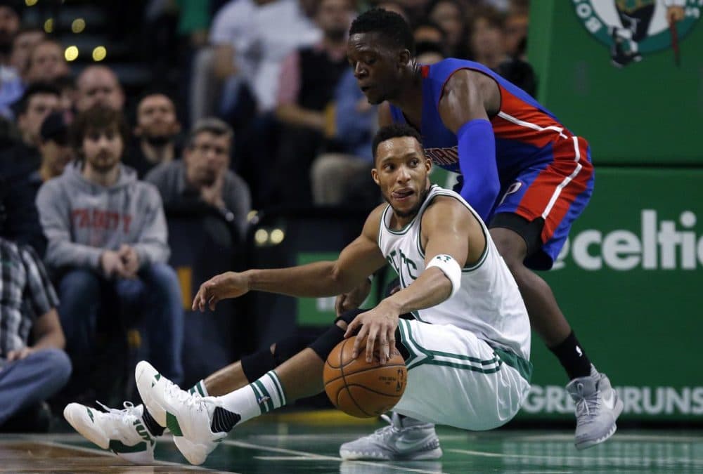 Boston Celtics' Evan Turner, bottom, in action against Detroit Pistons' Reggie Jackson during a game in Boston Wednesday. (Michael Dwyer/AP)