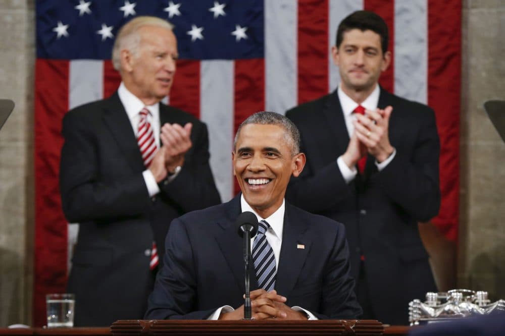 Vice President Joe Biden, left, and House Speaker Paul Ryan applaud President Obama during the State of the Union address Tuesday night. (Evan Vucci/AP)