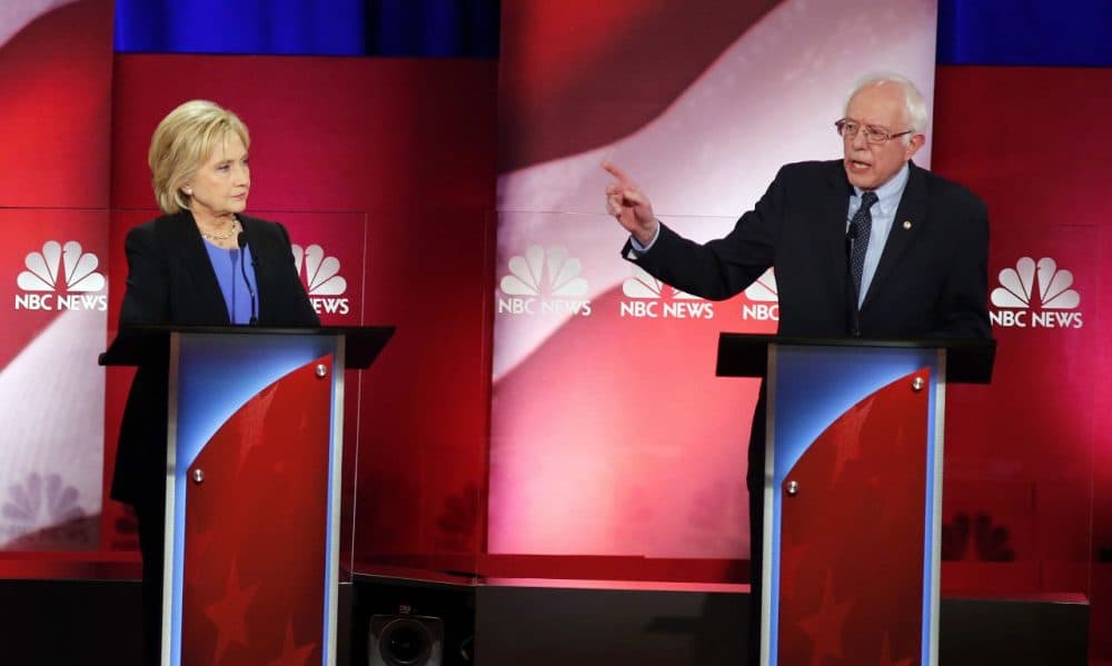 Bernie Sanders gestures toward Hillary Clinton during the Democratic presidential debate Sunday evening in Charleston, S.C. (Mic Smith/AP)