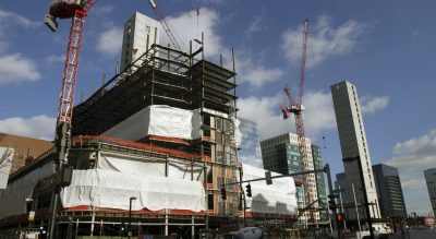 Construction takes place in the Seaport District Thursday, Jan. 14, 2016, in Boston. (Bill Sikes/AP)