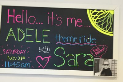 A sign in Boston's Back Bay SoulCycle studio promoting an Adele-themed class. (Nick Andersen / WBUR)