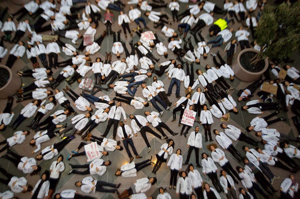 Some 100 Harvard Medical School students protested the deaths of unarmed black men at the hands of police as well as racial inequality in medical treatment. (Jesse Costa/WBUR)