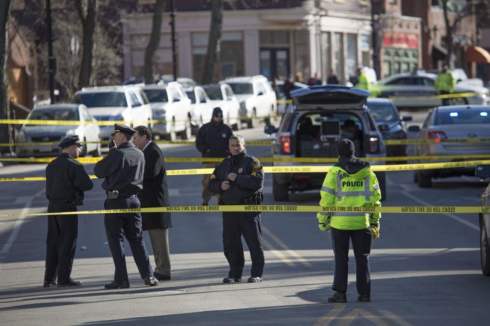 Brookline Police block off Harvard Street, after the report of a shooting midday Wednesday. (Jesse Costa/WBUR)