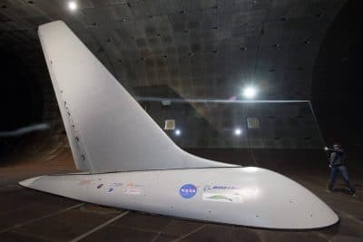Researchers with NASA's Environmentally Responsible Aviation project coordinated wind-tunnel tests of an Active Flow Control system -- tiny jets installed on a full-size aircraft vertical tail that blow air -- to prove they would provide enough side force and stability that it might someday be possible to design smaller vertical tails that would reduce drag and save fuel. (NASA/Dominic Hart)