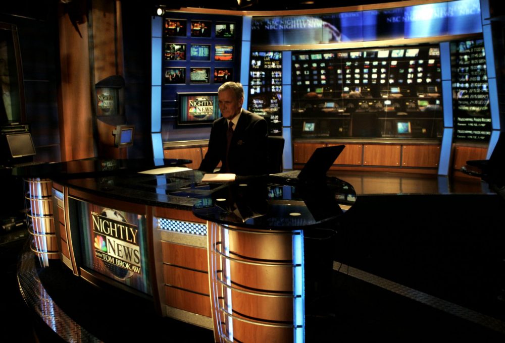 NBC announced it will end its affiliation with Channel 7 news in Boston. Nightly News anchor Tom Brokaw sits at his desk as the lights dim at the close of his last broadcast, in New York, Wednesday Dec. 1, 2004. . (AP Photo/Richard Drew)