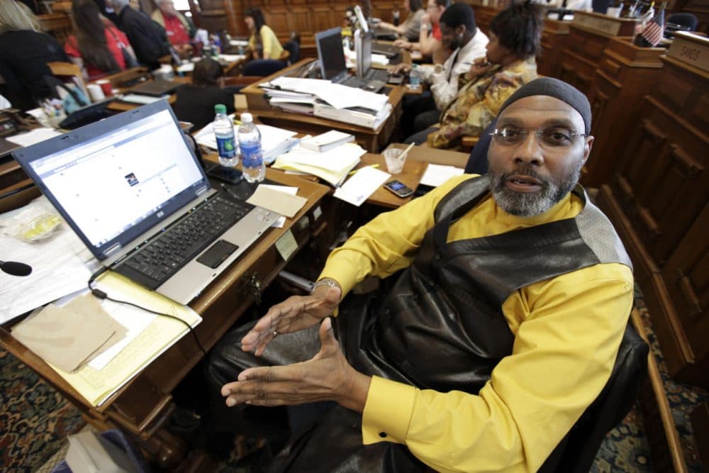 Rep. Ako Abdul-Samad, D-Des Moines, sits at his desk in the Iowa House Wednesday, April 4, 2012, at the Statehouse in Des Moines, Iowa. (Charlie Neibergall/AP)