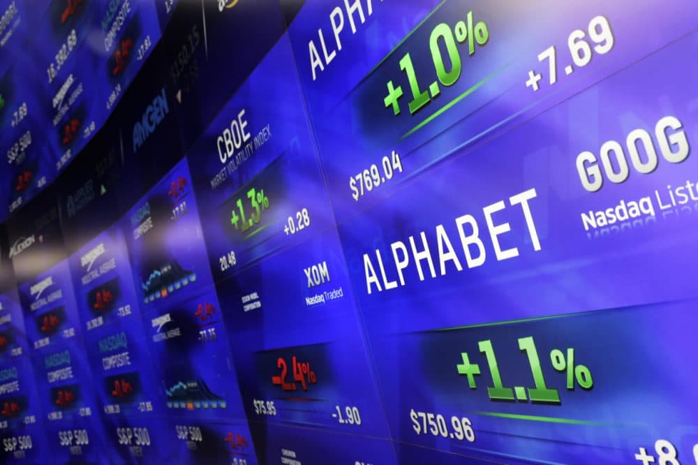 Electronic screens post prices of Alphabet stock, Monday, Feb. 1, 2016, at the Nasdaq MarketSite in New York. Alphabet, the parent company of Google, reports quarterly earnings Monday. (Mark Lennihan/AP)