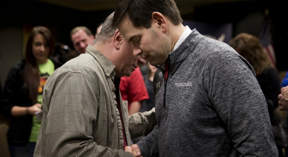 Republican presidential candidate, Sen. Marco Rubio, R-Fla., right, prays  after a rally on Jan. 30, 2016, in Council Bluffs, Iowa. (Jae C. Hong/ AP)