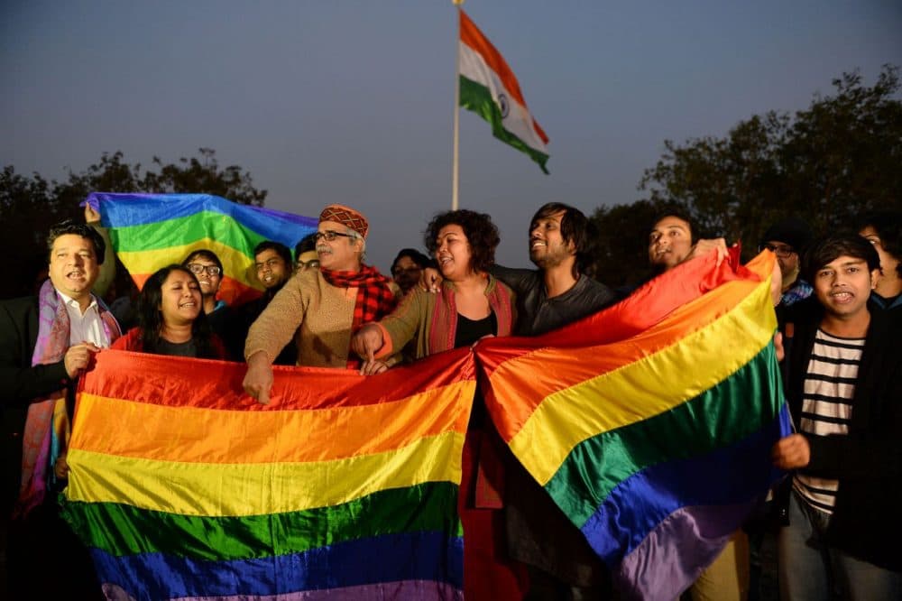 Indian gay rights activists celebrate after the country's Supreme Court agreed to review a decision which criminalises gay sex in New Delhi on February 2, 2016. India's top court agreed to review a decision which criminalises gay sex, sparking hope among campaigners that the colonial-era law will eventually be overturned in the world's biggest democracy.        (SAJJAD HUSSAIN/AFP/Getty Images)