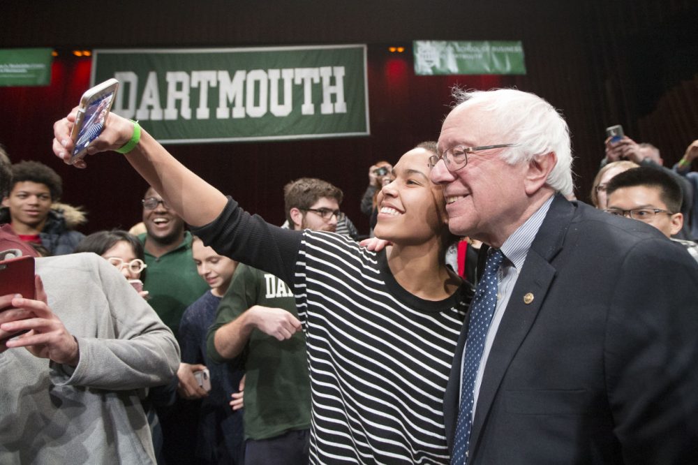 Democratic presidential candidate, Sen. Bernie Sanders (I-VT) has a selfie taken with an audience member after speaking at a campaign stop at Dartmouth College, Thursday, Jan. 14, 2016, in Hanover, N.H. (John Minchillo/AP)