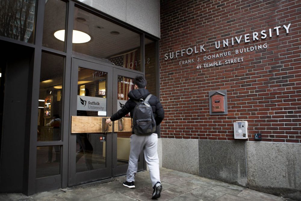 A student enters the Donahue Building at Suffolk University. (Jesse Costa/WBUR)