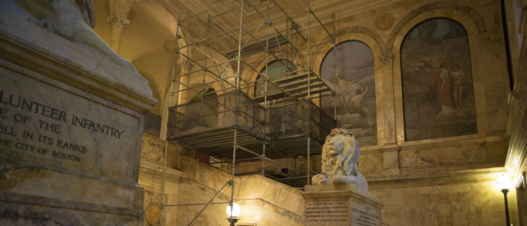 Scaffolding is set up along the grand staircase in the Boston Public Library's Copley Square branch, ahead of an effort to rescue and restore the &quot;philosophy&quot; mural. (Jesse Costa/WBUR)