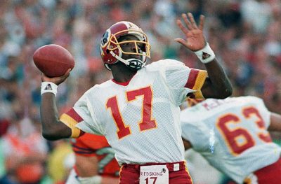 Justin Peters, who watched 49 straight  Super Bowls, rates Redskins quarterback Doug Williams' Super Bowl XXII performance as his favorite Super Bowl story because of the way it transcended football.  (AP Photo/Elise Amendola, File)
