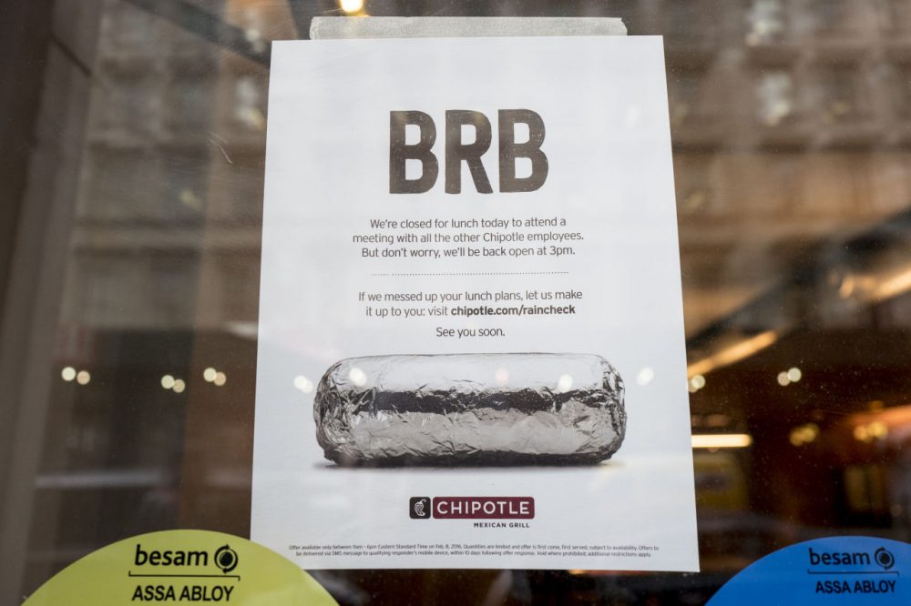 A sign sits in the window of a Chipotle restaurant on Broadway in Lower Manhattan telling customers the restaurant is closed until 3 p.m. on February 8, 2016 in New York City. The Mexican food chain is closing stores for lunch nationwide for a meeting on food safety following a number of E. coli outbreaks. (Andrew Renneisen/Getty Images)
