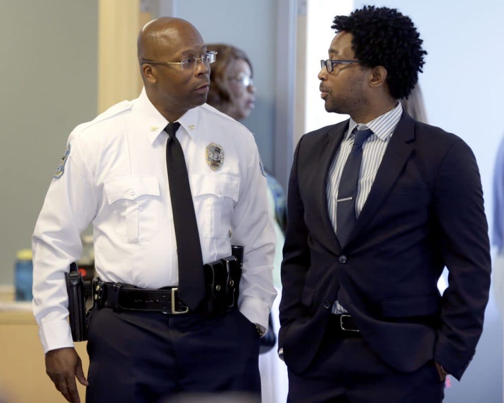 Andre Anderson speaks with Ferguson City Council member Wesley Bell, right, after being introduced as the the interim chief of the Ferguson Police Department during a news conference Wednesday, July 22, 2015, in Ferguson, Mo. (Jeff Roberson/AP)