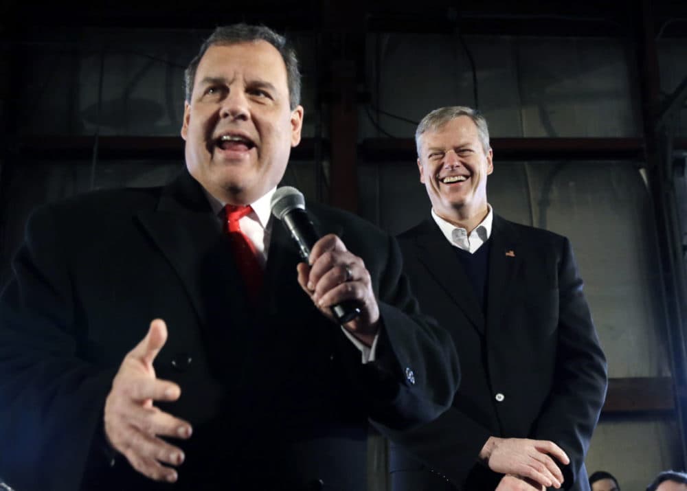At a recent campaign event for Gov. Christie, who has since exited the presidential race, Baker laughs as the governor speaks before a crowd in Bedford, N.H. (Elise Amendola/AP)