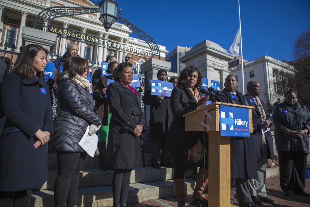 Surrounded by other minority leaders, Boston City Councilor Ayanna Pressley speaks at a State House rally Wednesday for Democratic presidential candidate Hillary Clinton. (Jesse Costa/WBUR)