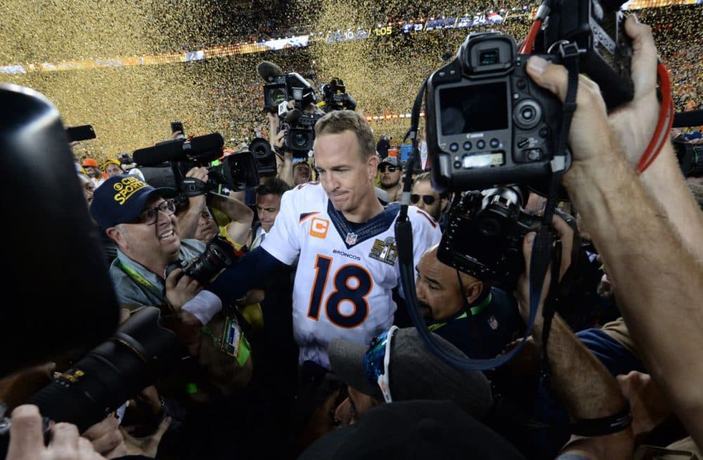 Quarterback Petyton Manning of the Denver Broncos is surrounded by the media following victory over the Carolina Panthers in Super Bowl 50 at Levi's Stadium in Santa Clara, California February 7, 2016.
Peyton Manning clinched a fairytale second Super Bowl victory as the Denver Broncos produced an astonishing defensive display to defeat the Carolina Panthers 24-10. (Timothy A. Clary/AFP/Getty Images)