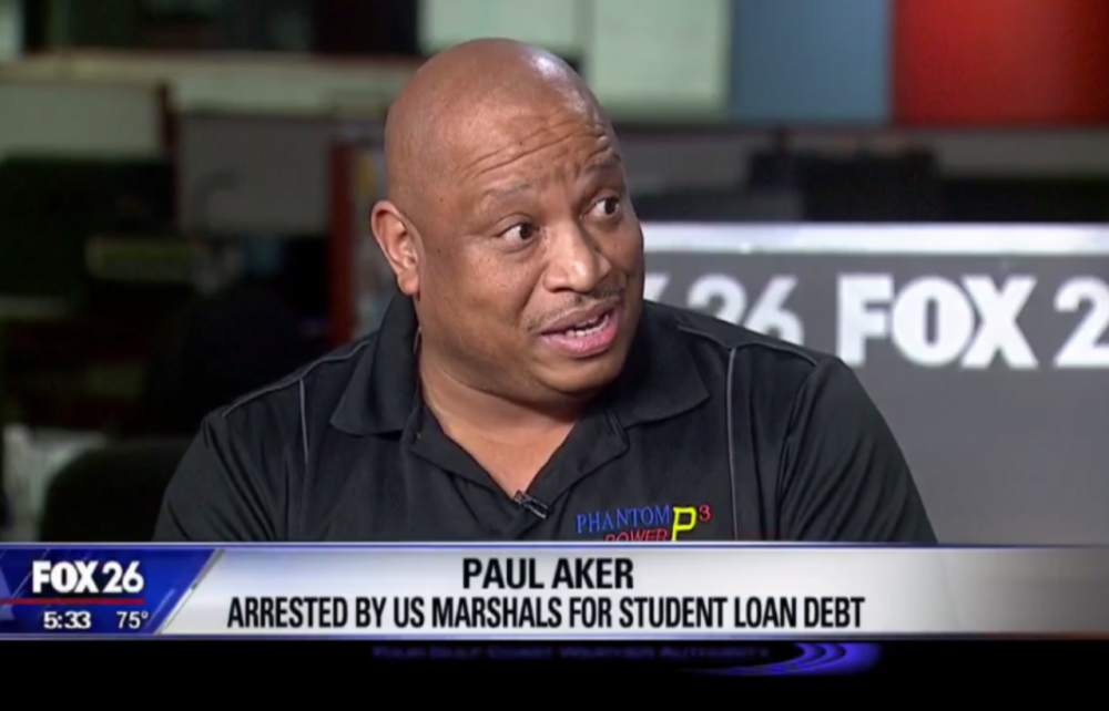 In this screen grab from Houston Fox 26, Paul Aker describes how he was arrested by U.S. Marshals for his student loan debt. (Screenshot)