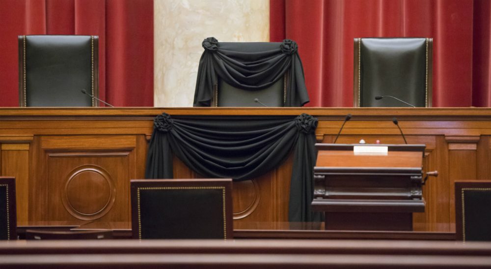 Steve Almond: Those who are distressed at Justice Scalia's passing should think about what it means that, not an hour after his death, they stood ready to defile all that he stood for. In this photo, Scalia’s courtroom chair is draped in black to mark his death as part of a tradition that dates to the 19th century. Scalia died Feb. 13 at age 79. (J. Scott Applewhite/AP)