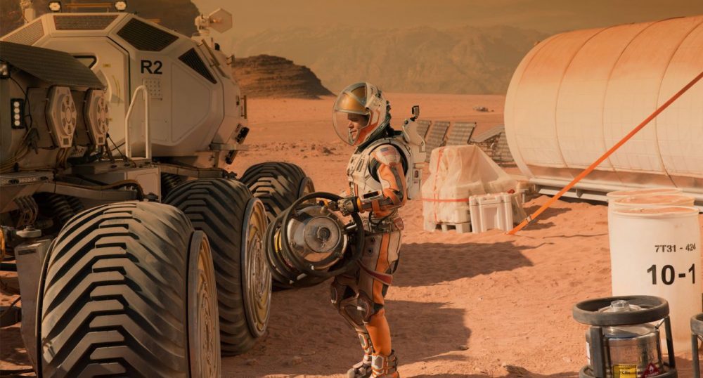 Astronaut Mark Watney, played by Matt Damon, works to survive alone on Mars in &quot;The Martian.&quot; (Courtesy 20th Century Fox)