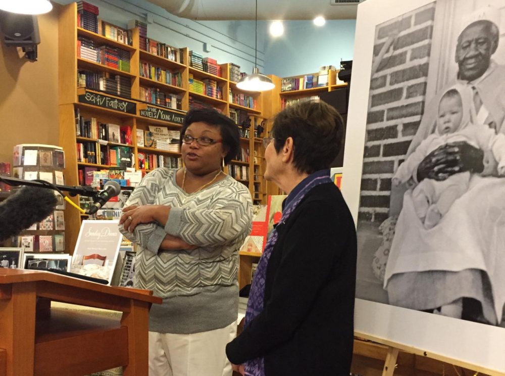 Andrea Scott, left, and Ann Walling speak at Parnassus Books. In the background is a photo of Andrea's great-great-great-grandmother Mary Scott holding Walling as a baby. (Kim Green)