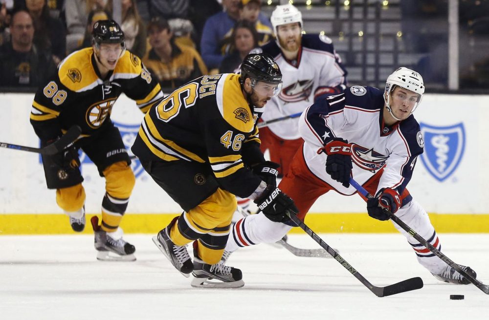 Boston Bruins' David Krejci (46) and Columbus Blue Jackets' Alexander Wennberg (41) battle for the puck during last night's game at the Garden. The Blue Jackets won 6-4. (Michael Dwyer/AP)