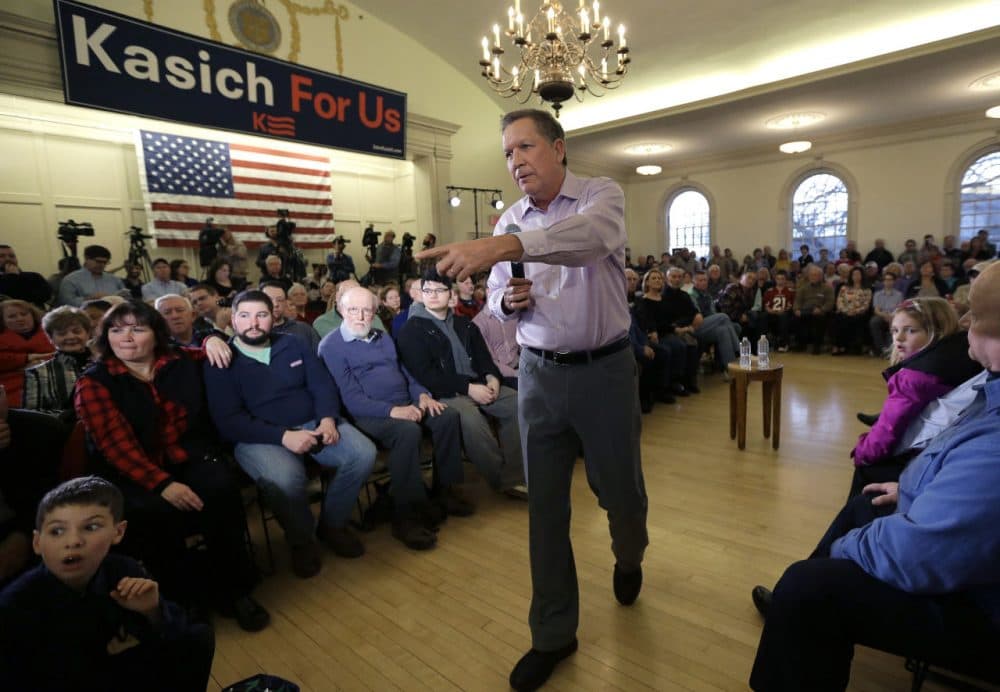 Republican presidential candidate, Ohio Gov. John Kasich, takes questions from the audience while holding a town hall event Monday in Plymouth. (Steven Senne/AP)