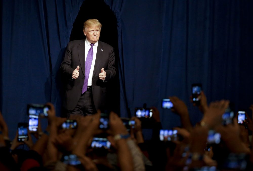Republican presidential candidate Donald Trump arrives for a caucus night rally Tuesday, Feb. 23, 2016, in Las Vegas. (AP Photo/Jae C. Hong)