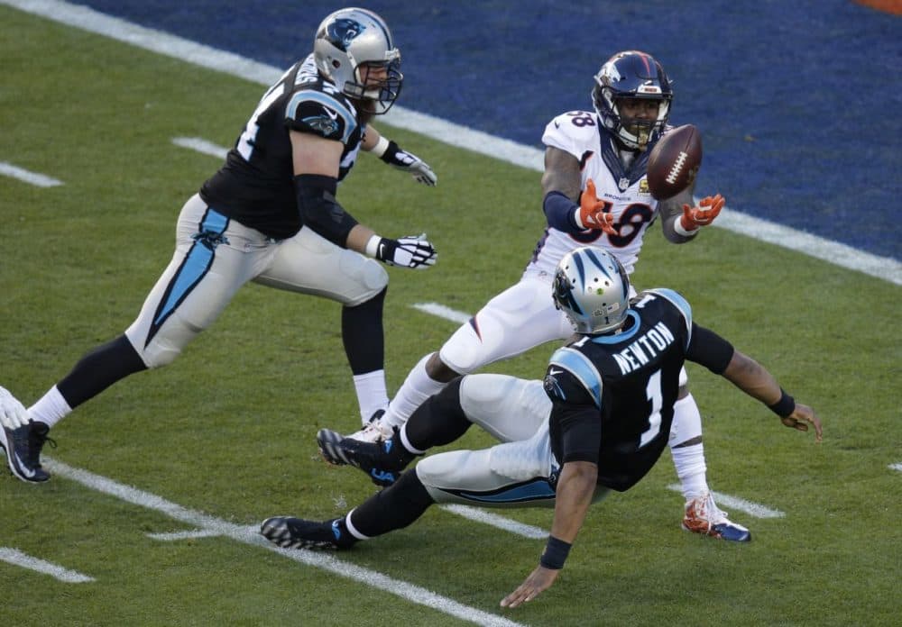 Broncos' Von Miller -- the Super Bowl MVP -- strips the ball from Panthers' QB Cam Newton (1) during the first half of the NFL Super Bowl on Sunday.  (Charlie Riedel/AP)