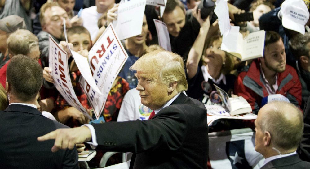 Republican presidential candidate Donald Trump gestures as he signs autographs at a campaign event Sunday, Feb. 21, 2016, in Atlanta. (David Goldman/AP)