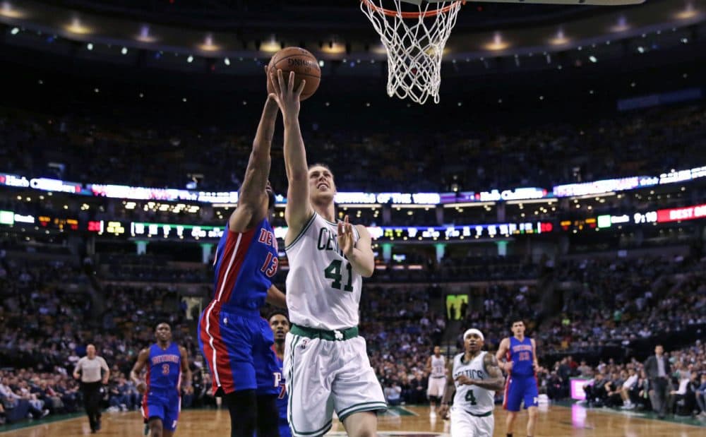 Celtics center Kelly Olynyk drives to the basket past Pistons forward Marcus Morris during the second half Wednesday night. The Celtics defeated the Pistons 102-95. (Charles Krupa/AP)