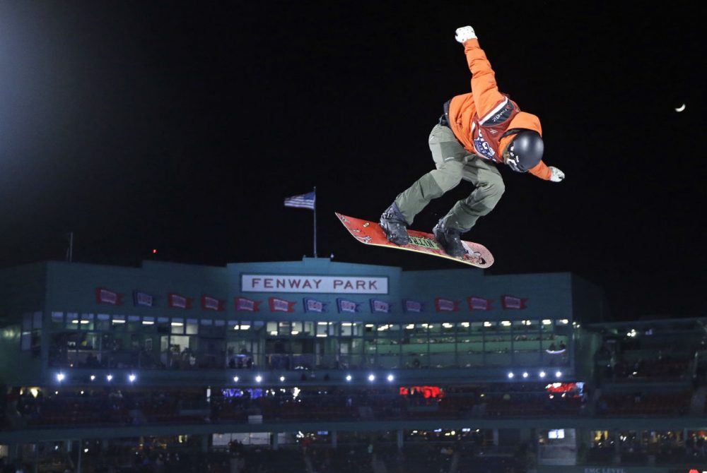 Snowboarder Michael Schaerer, of Switzerland, jumps during the Big Air at Fenway skiing and snowboarding U.S. Grand Prix tour event. (Elise Amendola/AP)