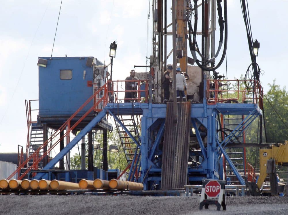 The Baker administration is counting on natural gas from Pennsylvania. In this 2012 file photo, a crew works on a drilling rig at a well site for shale-based natural gas in Zelienople, Pa. (Keith Srakocic/AP)