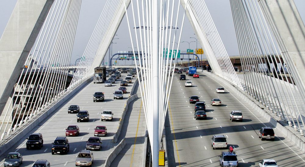 Thomas J. Fitzgerald: &quot;Massachusetts had a net loss in domestic migration of 21,805 residents from July 2014 to July 2015, roughly the equivalent of losing the town of Winchester.&quot;
Pictured: A stretch of Interstate 93 over the Leonard P. Zakim Bunker Hill Bridge in Boston. (Michael Dwyer/AP)