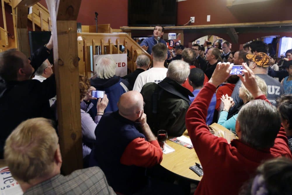 Republican presidential candidate, Sen. Ted Cruz, R-Texas, (middle, back) speaks during a campaign event at Generals Sports Bar and Grill, Thursday, Feb. 4, 2016, in Weare, N.H. (AP Photo/Elise Amendola)