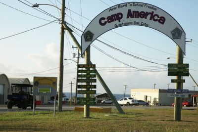In this Feb. 2, 2016 photo, the entrance to Camp America is seen at U.S. Guantanamo Naval Base, Cuba. After 14 years, the detention center appears to be winding down despite opposition in Congress to President Barack Obamas intent to close the facility and confine the remaining prisoners someplace else. A military task force of 2,000 is now devoted to holding just 91 men, a number expected to drop by a third this summer. (AP Photo/Ben Fox)