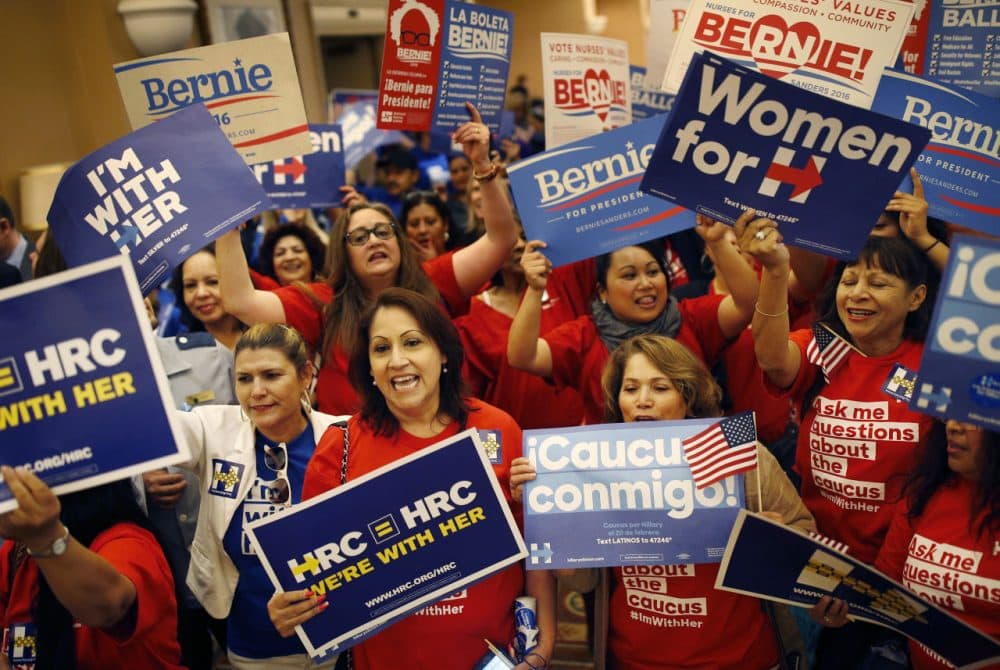 Supporters of Hillary Clinton and Bernie Sanders cheer on their candidates during the Nevada Democratic caucus on Saturday. (AP Photo/John Locher)