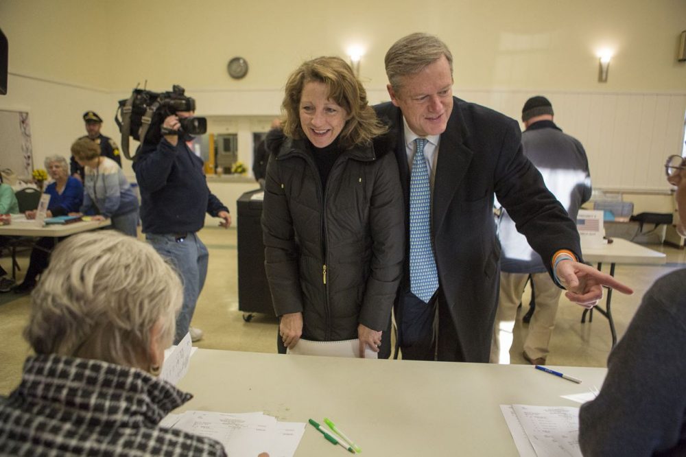 Massachusetts Gov. Charlie Baker and his wife Lauren check in to vote in Swampscott on Super Tuesday. (Jesse Costa/WBUR)