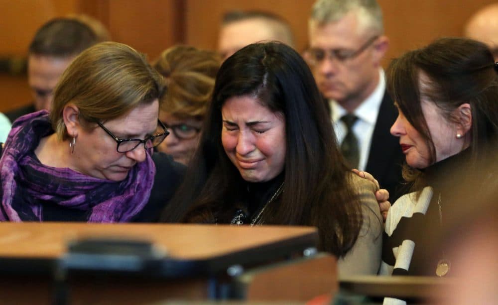 Diane Chism, mother of Philip Chism, sobs while being consoled during her son's sentencing in the murder and rape of Colleen Ritzer. (David Le/The Salem News/AP)
