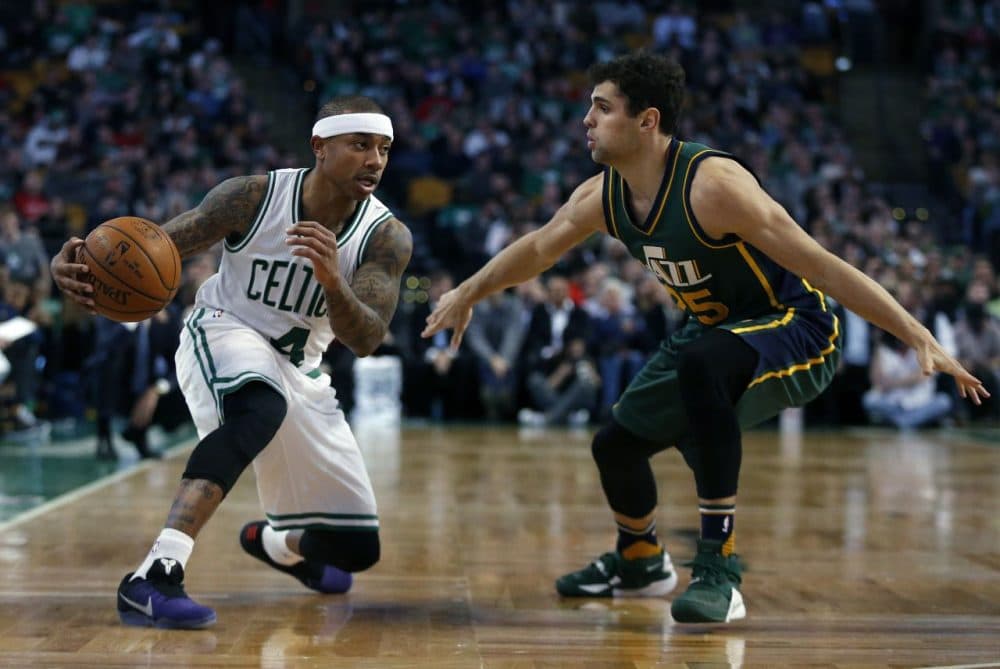 Utah Jazz's Raul Neto (25) defends against Boston Celtics' Isaiah Thomas (4) during last night's game. The Celtics won 100-95. (Michael Dwyer/AP)