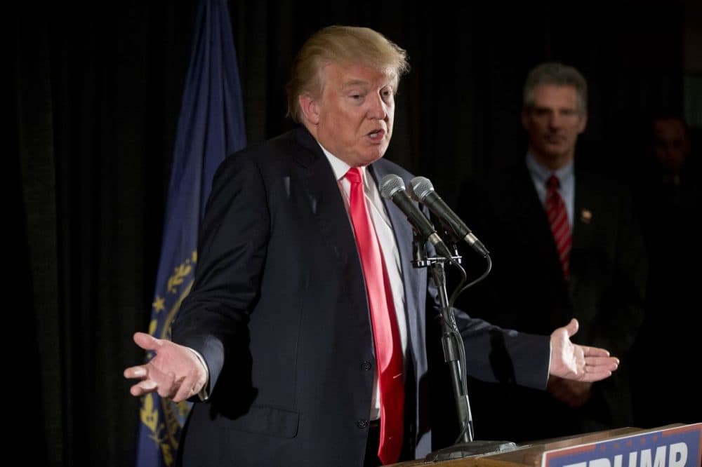 Republican presidential candidate Donald Trump accompanied by former Mass. Sen. Scott Brown speaks with members of the media in Milford, N.H. (Matt Rourke/AP)
