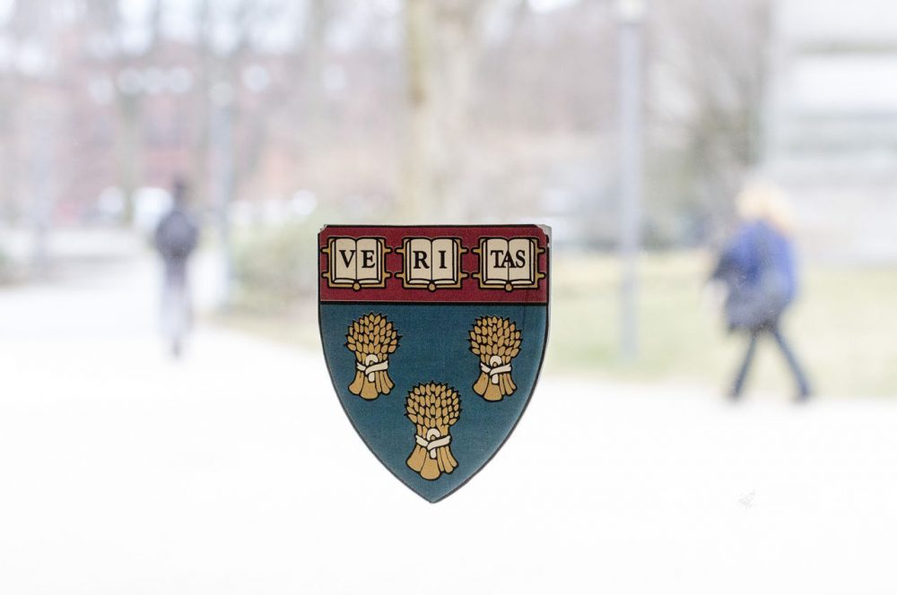 The Harvard Law School shield is seen on a window on campus. (Joe Difazio for WBUR)