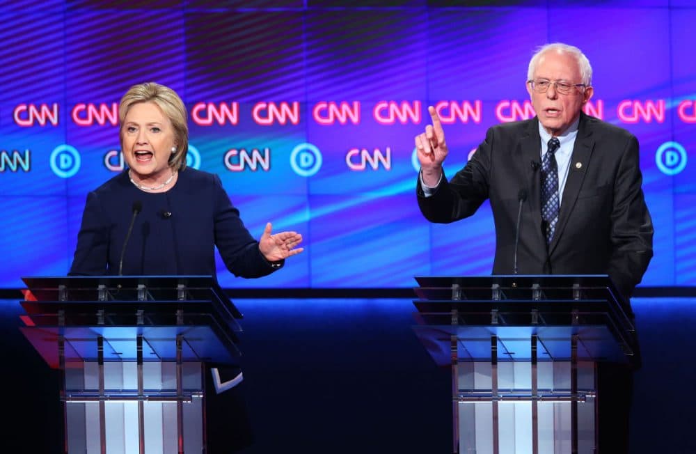 Democratic presidential candidate Senator Bernie Sanders (D-VT) and Democratic presidential candidate Hillary Clinton speak during the CNN Democratic Presidential Primary Debate at the Whiting Auditorium at the Cultural Center Campus on March 6, 2016 in Flint, Michigan. (Scott Olson/Getty Images)