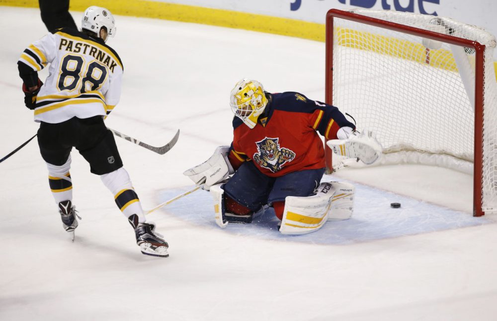 Boston Bruins right wing David Pastrnak scores against Florida Panthers goalie Roberto Luongo  during the first period. (Wilfredo Lee/AP)