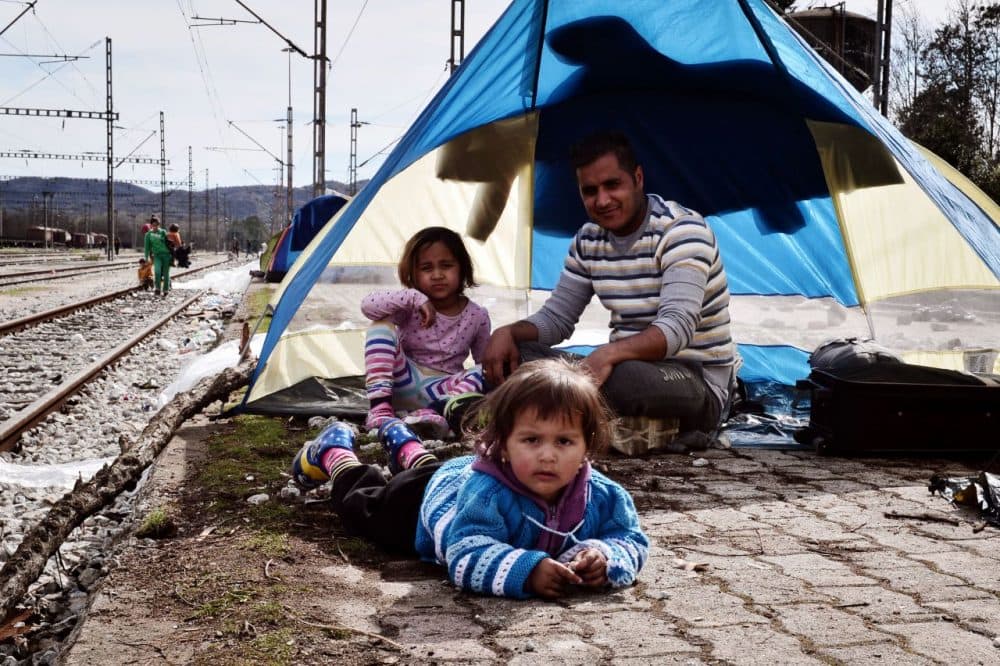 A family sits at the makeshift camp at the Greek-Macedonian border, near the village of Idomeni on March 8, 2016, where thousands of refugees and migrants are stranded. European Unions leaders held a summit with Turkey's prime minister on March 7 in order to back closing the Balkans migrant route and urge Ankara to accept deportations of large numbers of economic migrants from overstretched Greece. More than one million refugees and migrants have arrived in Europe since the start of 2015 -- the majority fleeing the war in Syria -- with nearly 4,000 dying while crossing the Mediterranean. (Louisa Gouliamaki/AFP/Getty Images)