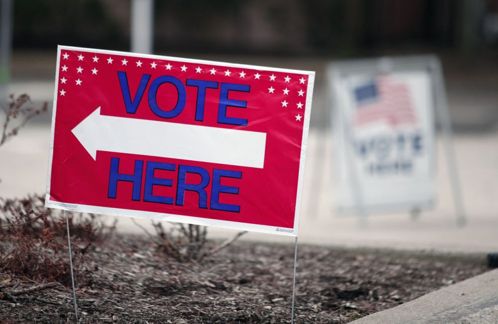 A sign directs residents to vote in the Michigan primary March 8, 2016 in Royal Oak, Michigan. There are 59 Republican delegates and 130 Democratic delegates up for grabs in Michigan. Mississippi and Idaho are also holding primaries and Hawaii is holding a caucus. (Bill Pugliano/Getty Images)