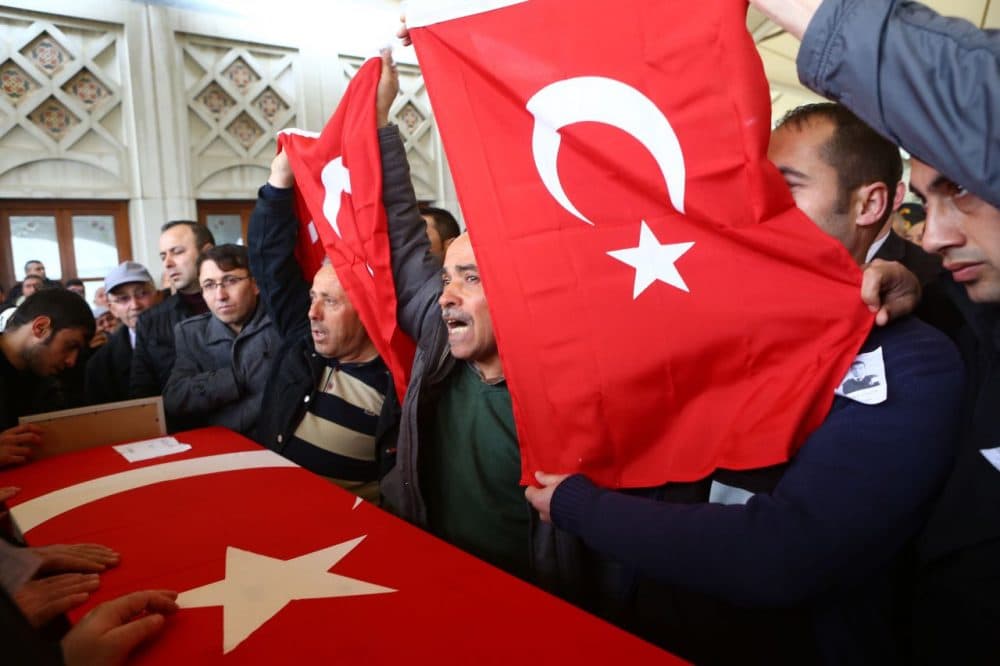 Men hold Turkish flags over the coffin of a victim in a mosque in Ankara, on March 14, 2016, a day after a suicide car bomb ripped through a busy square in central Ankara killing 37 people and wounding 125, officials said. 
No one has claimed the attack, the latest in a spate of deadly attacks to hit Turkey. Turkish warplanes on March 14 struck the outlawed Kurdistan Workers' Party (PKK) in the mountainous Kandil and Gara regions in northern Iraq, the army said. (ADEM ALTAN/AFP/Getty Images)